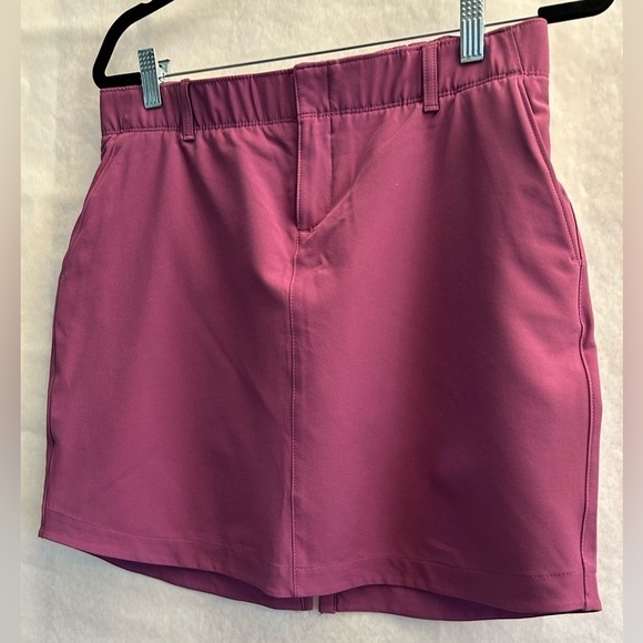 Under Arnour women’s Links woven golf performance skort in purple Sz-8. L19 - Picture 1 of 9